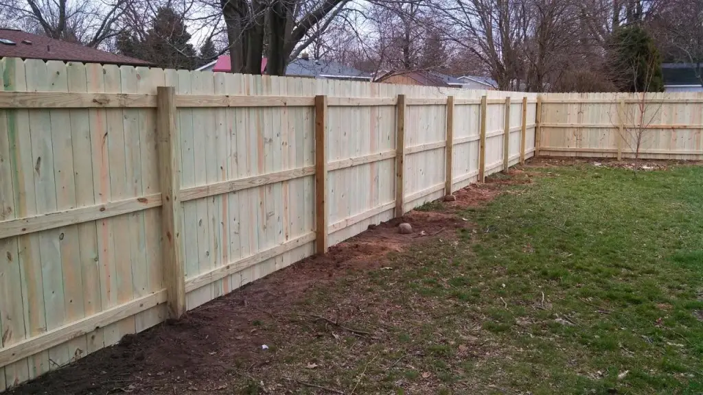 treated-wood_dog-eared-style_wood-fence_2-1024x576-1